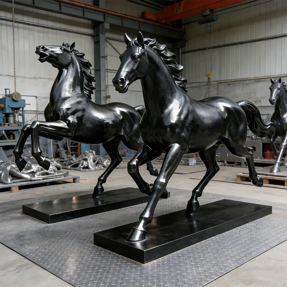 Black horse sculptures in factory workshop