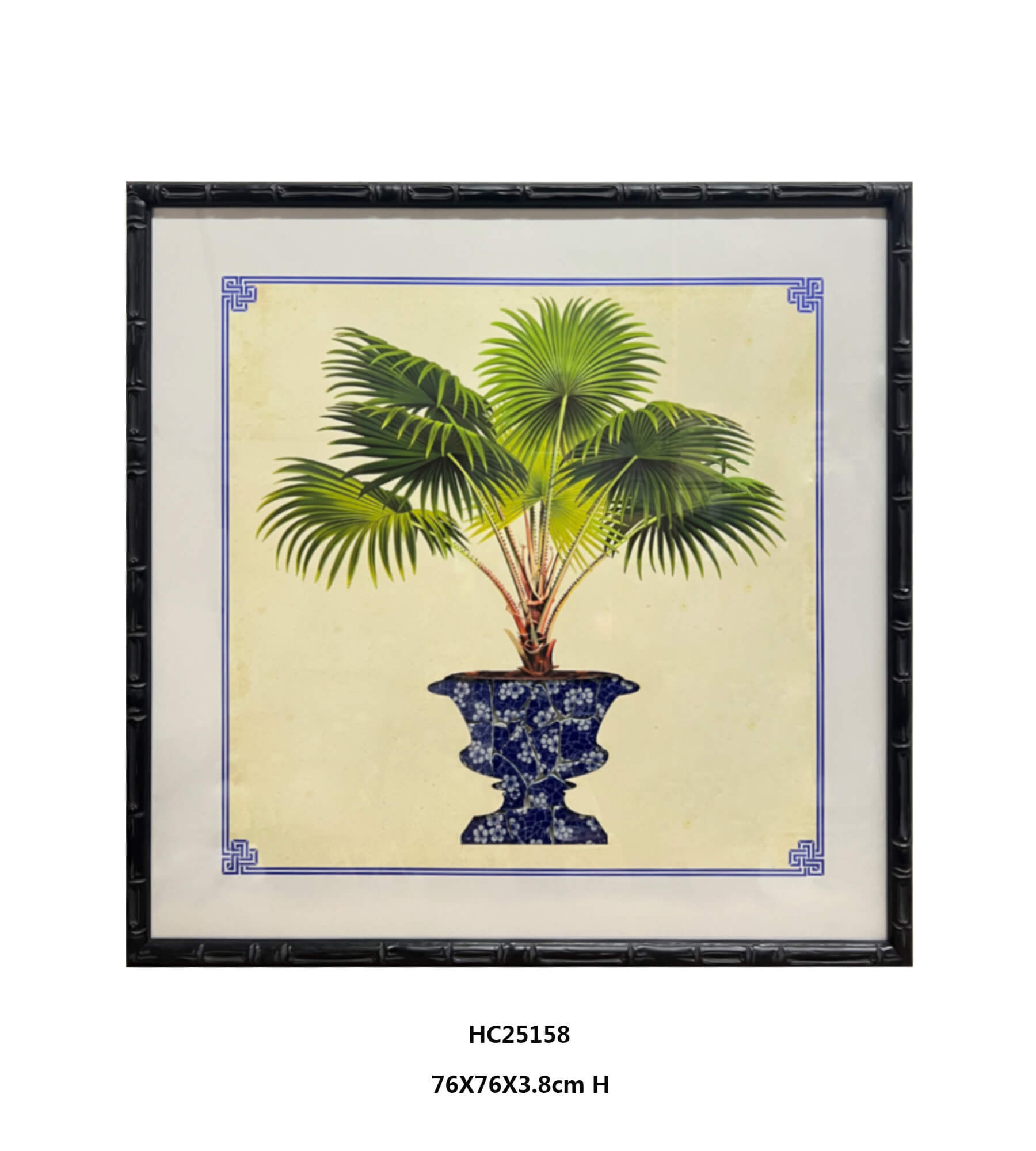 Framed fan palm art with blue and white porcelain planter