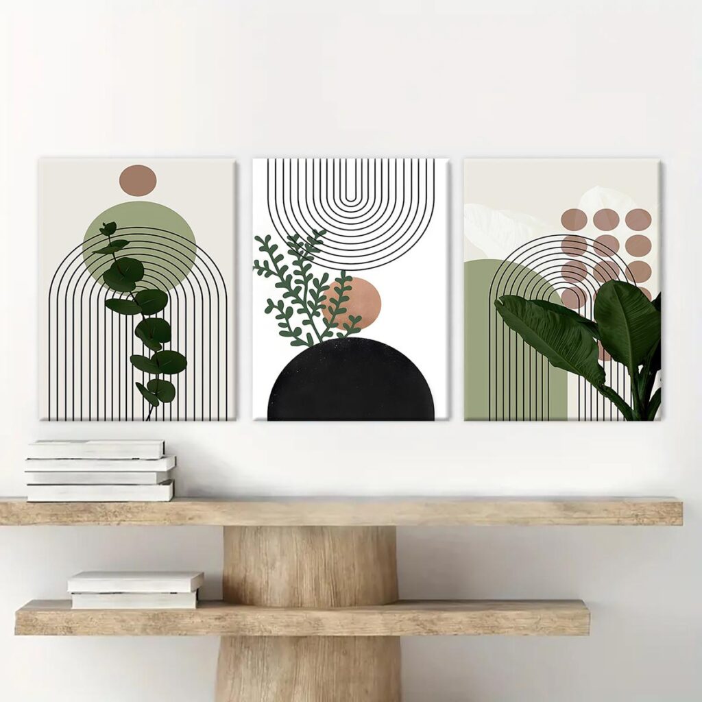 Framed botanical canvas wall art above a light wood console