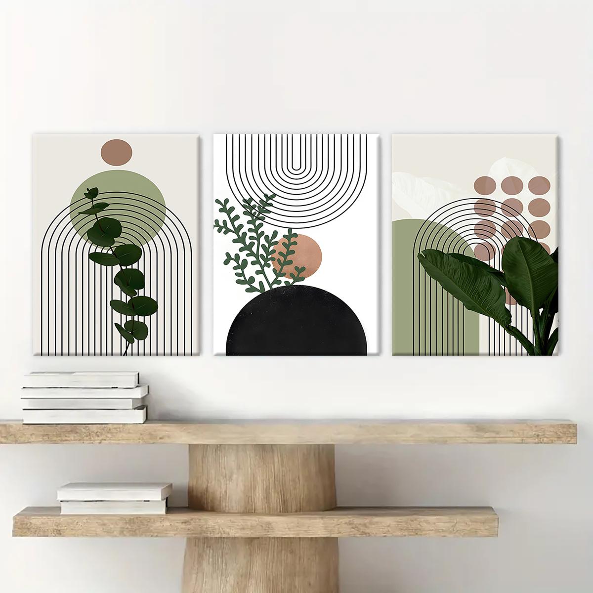 Framed botanical canvas wall art above a light wood console