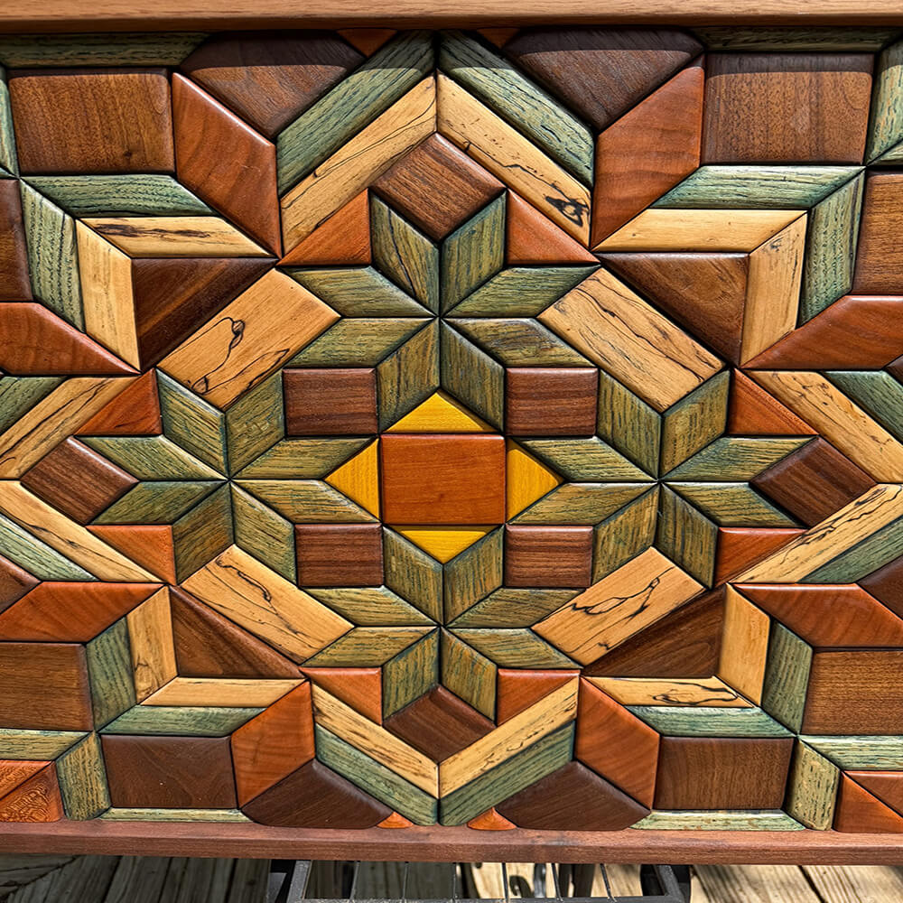 Close-up of geometric wood quilt mosaic showing natural grain