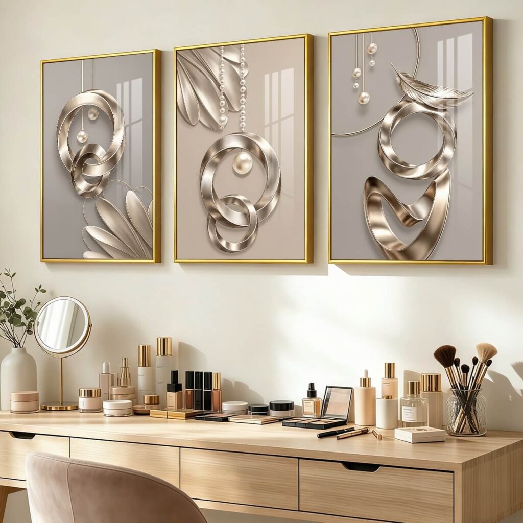 Gold 3 piece canvas wall art styled above a neutral vanity table