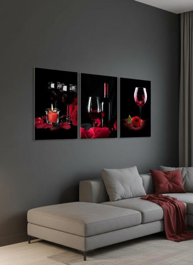 Red wine canvas wall art triptych above a modern sofa