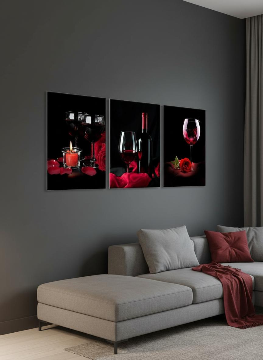 Red wine canvas wall art triptych above a modern sofa