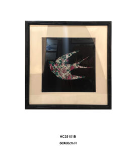 Single floral porcelain mosaic swallow on a black background