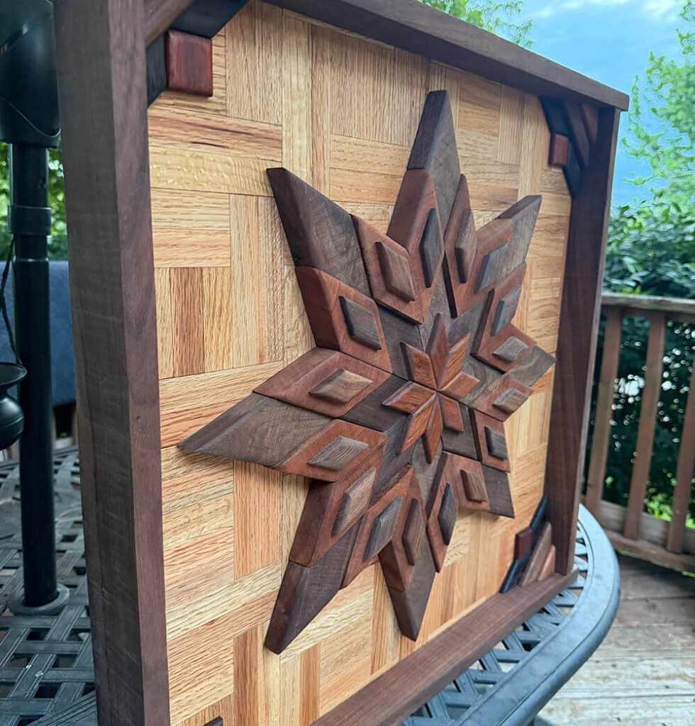 Framed wooden barn quilt star