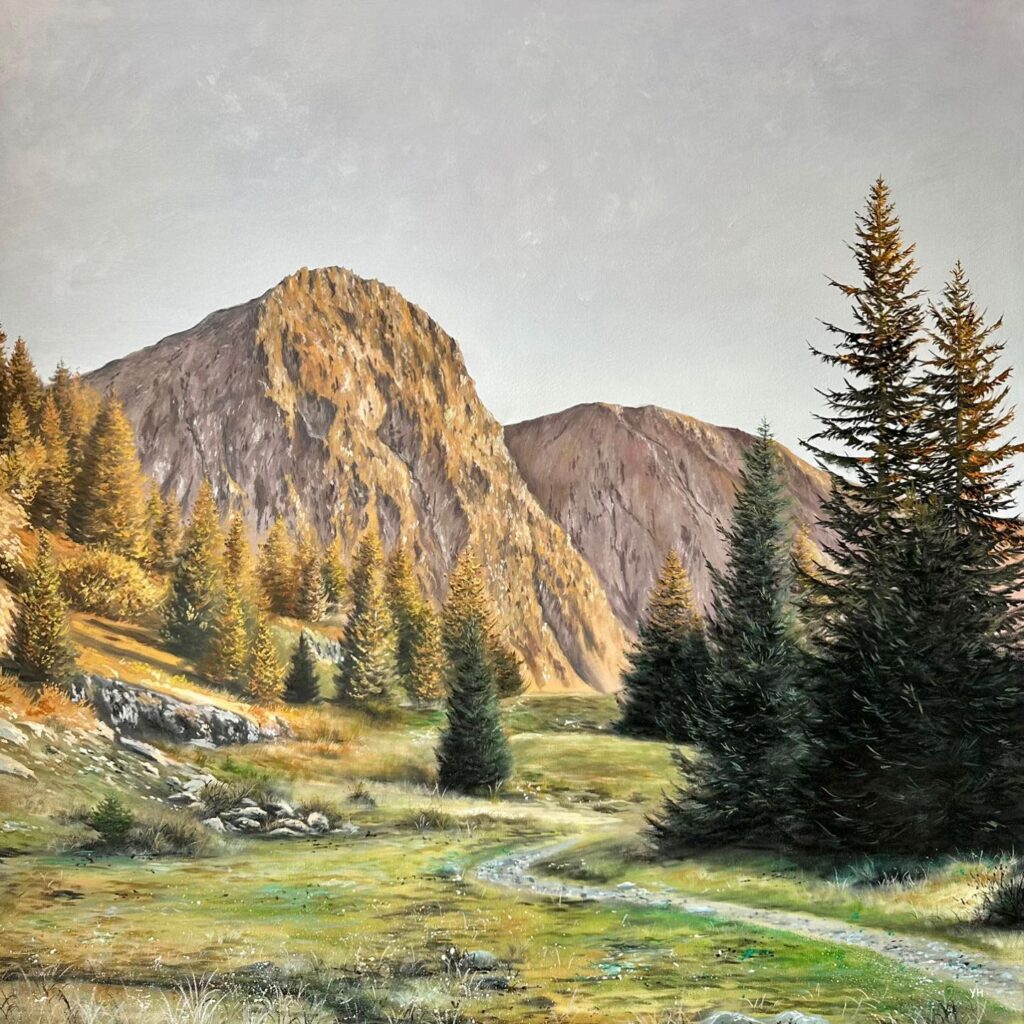 Golden mountain valley with pine trees and a winding trail