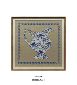 Framed blue and white pitcher wall art with botanical bird motifs
