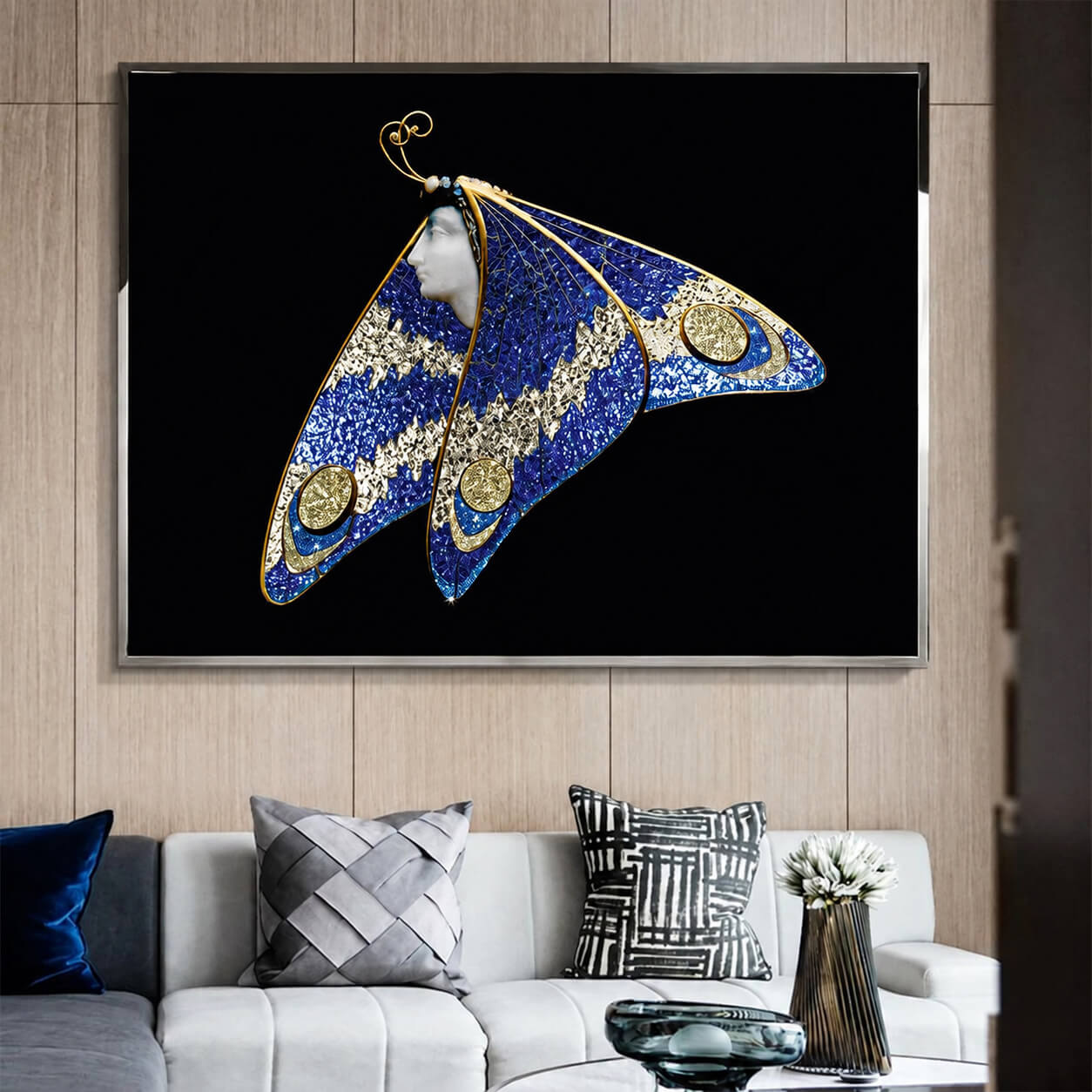 Blue and gold butterfly wall art above a light sofa on wood paneling
