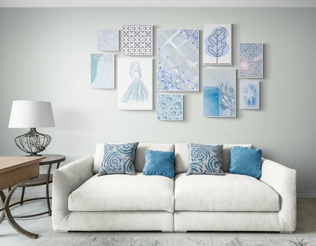 Blue wall gallery art above a white sofa