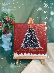 Red Christmas tree canvas wall art displayed on an easel