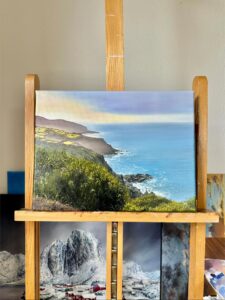 Coastal cliff oil painting with green hills and blue sea