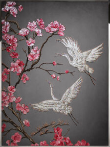 Mother of pearl cranes and pink plum blossoms on a gray background