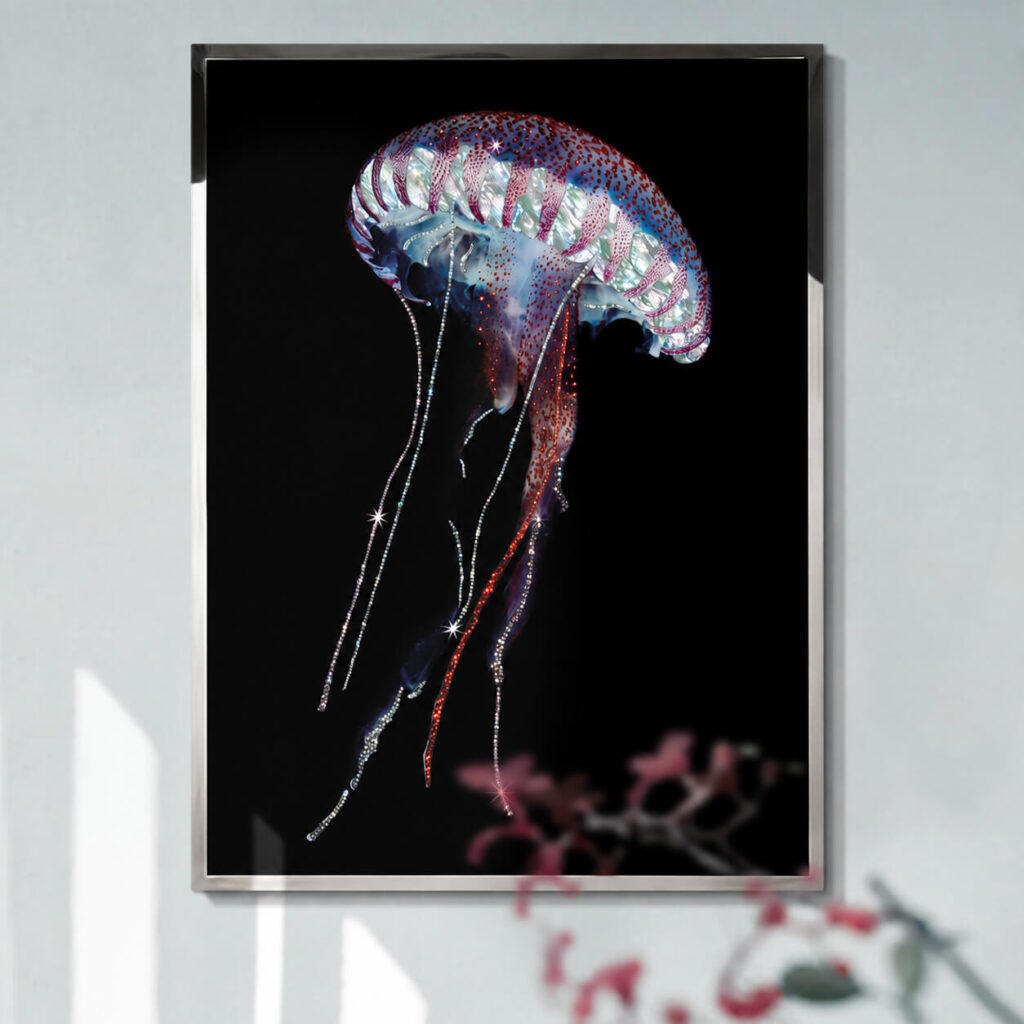 Jellyfish wall art with long sparkling tentacles in a dark frame
