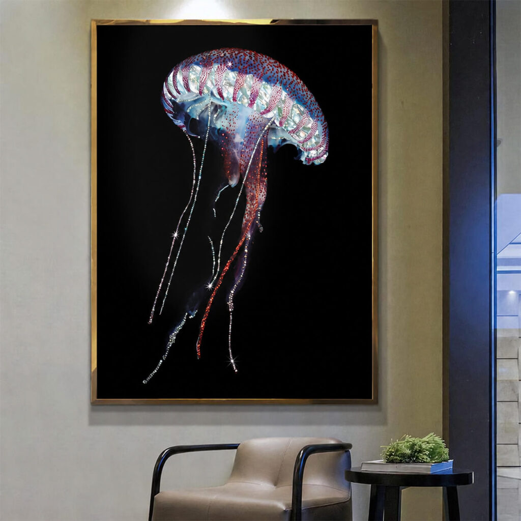 Gold framed jellyfish wall art displayed above a modern accent chair