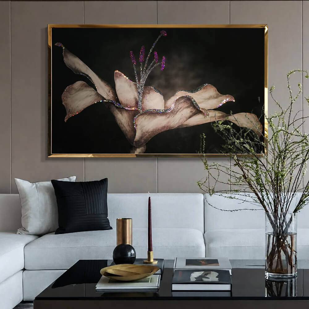 Crystal lily wall art in a gold tone frame above a modern sofa