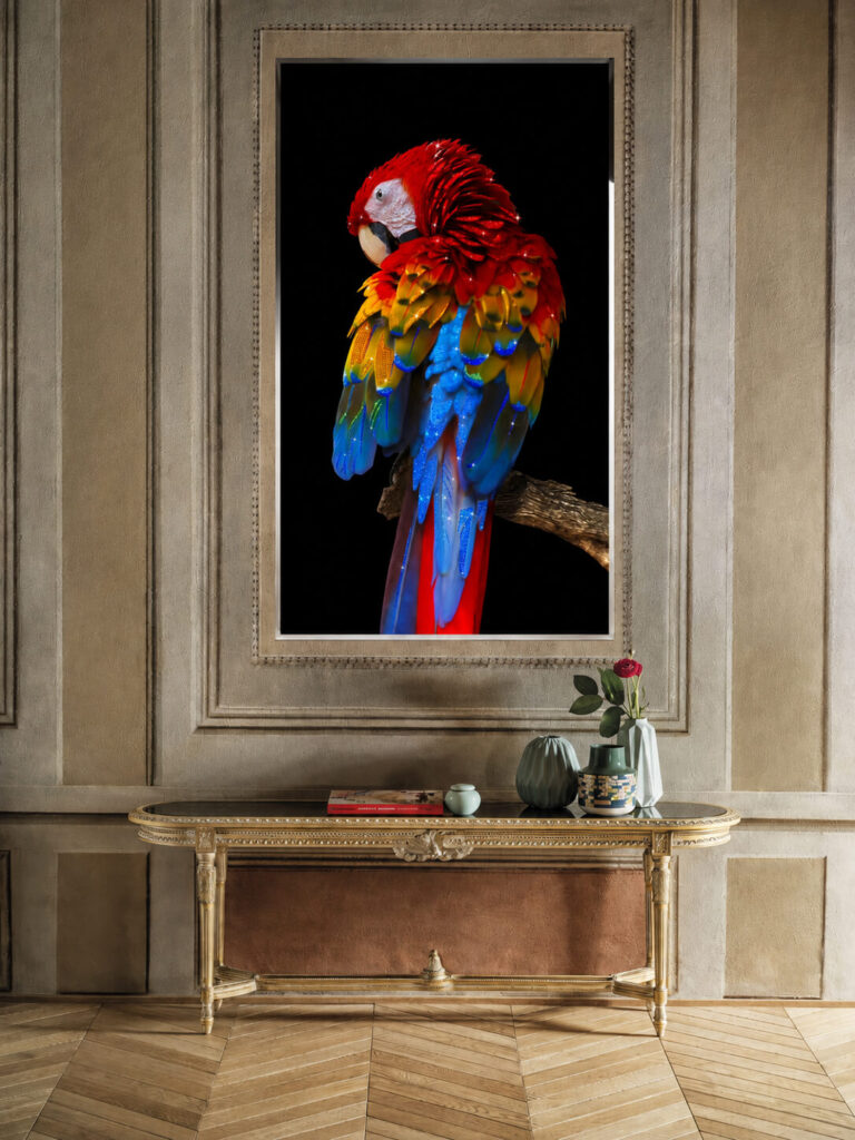 Crystal parrot wall art above a fireplace mantel