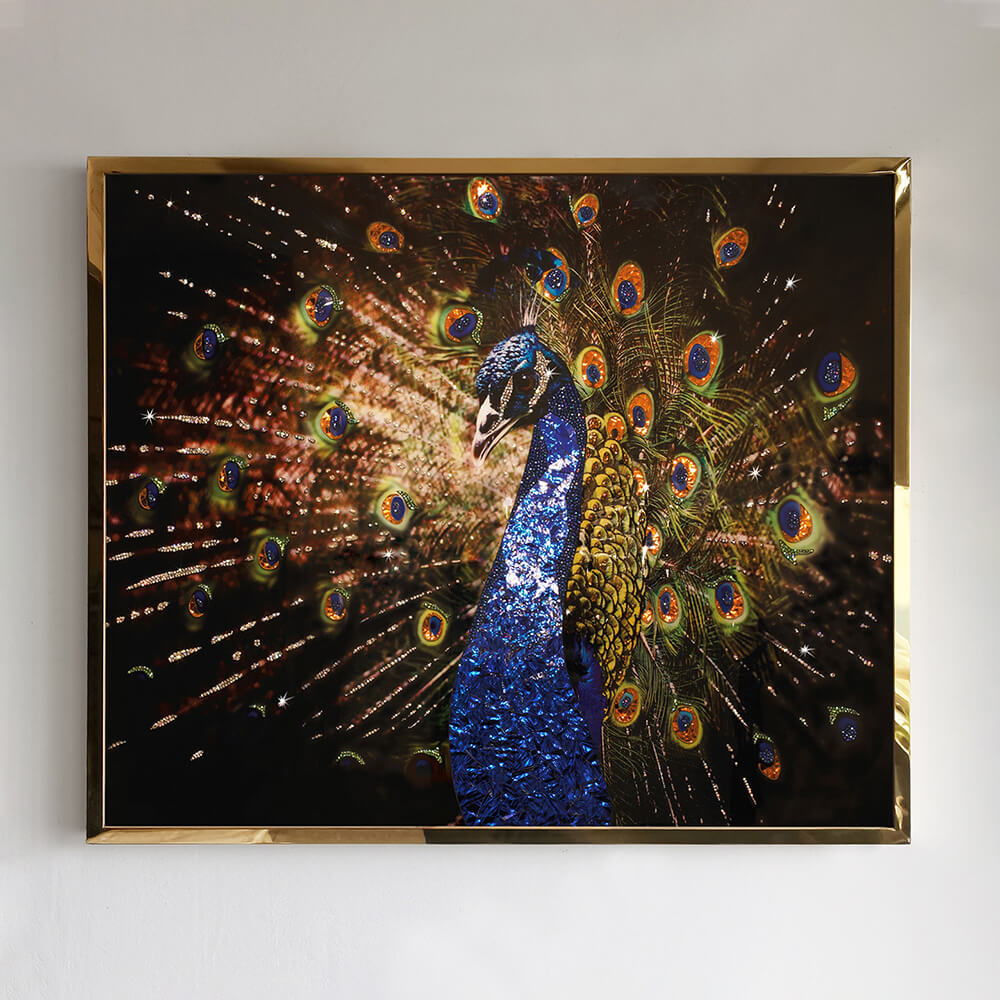 Close view of blue and gold crystal peacock wall art