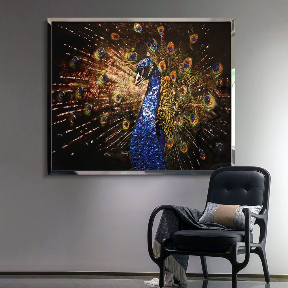 Crystal peacock wall art above a black chair in a modern room