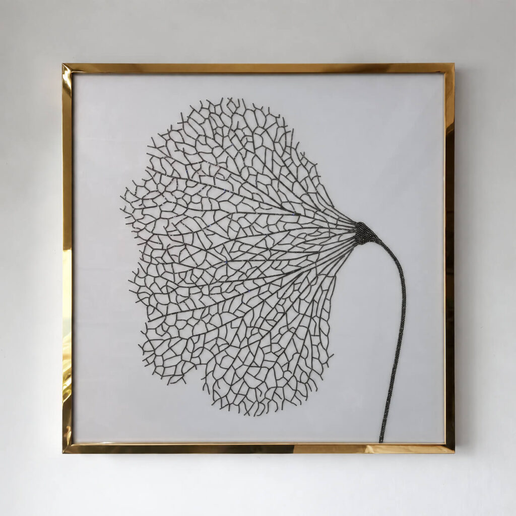 Close view of the black leaf motif with Swarovski crystal accents