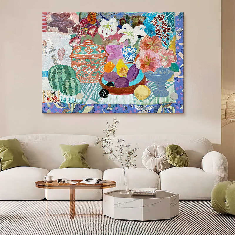 Floral still life oil painting above a cream sofa in a modern living room