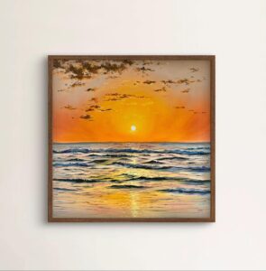 Framed coastal sunset wall art in a neutral interior