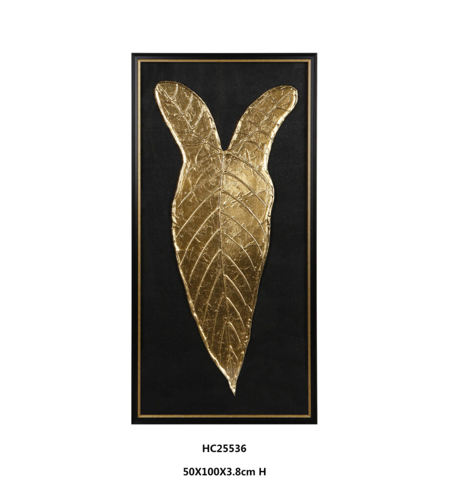 Framed gold metallic leaf wall art on a black background