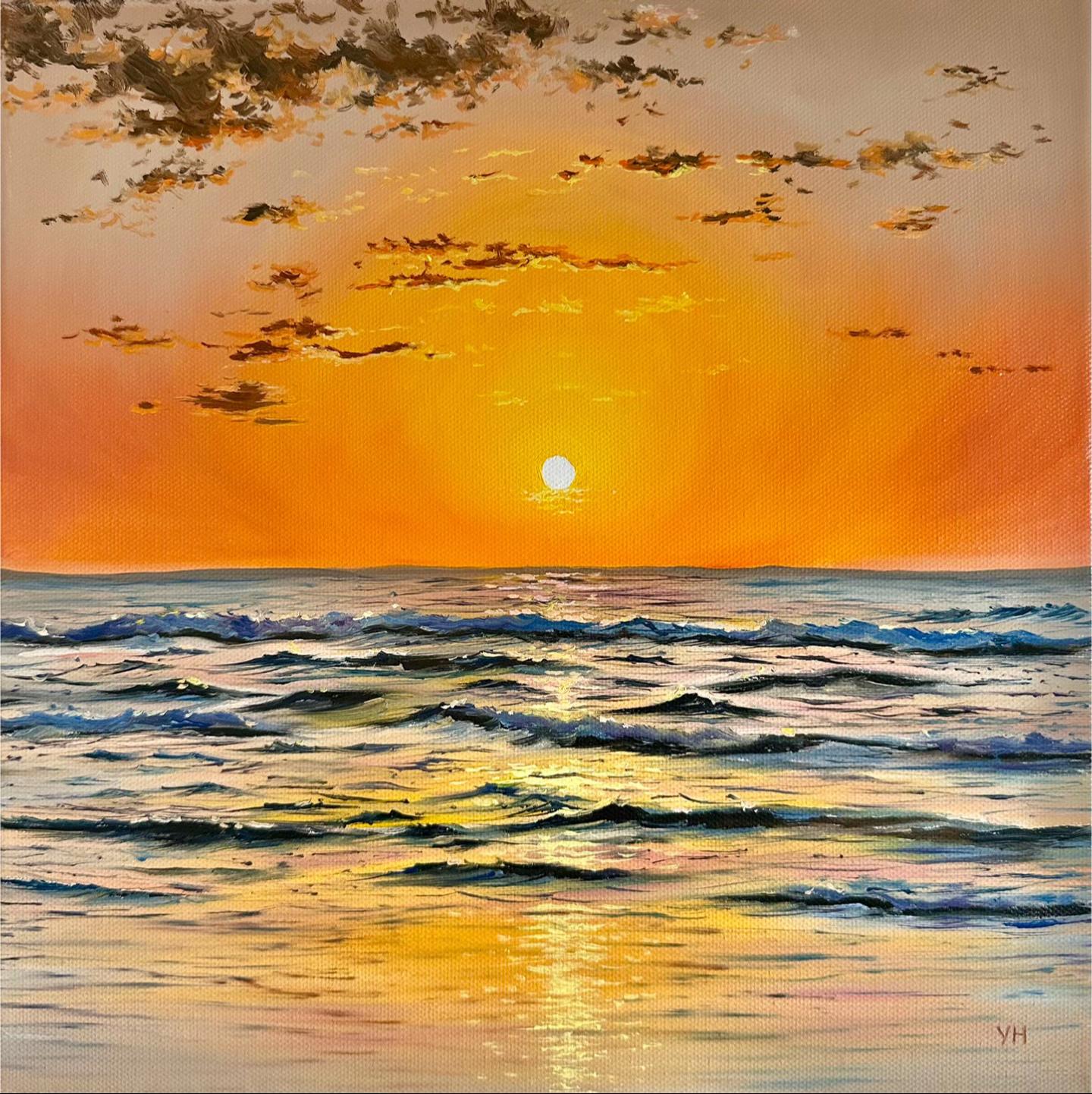 Golden sunset seascape with layered blue ocean waves