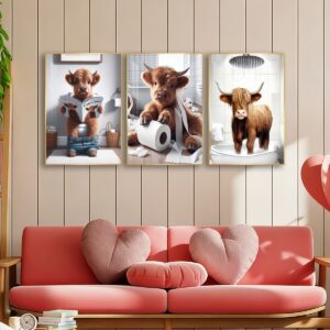 Highland cow bathroom canvas wall art set of 3 above a pink sofa