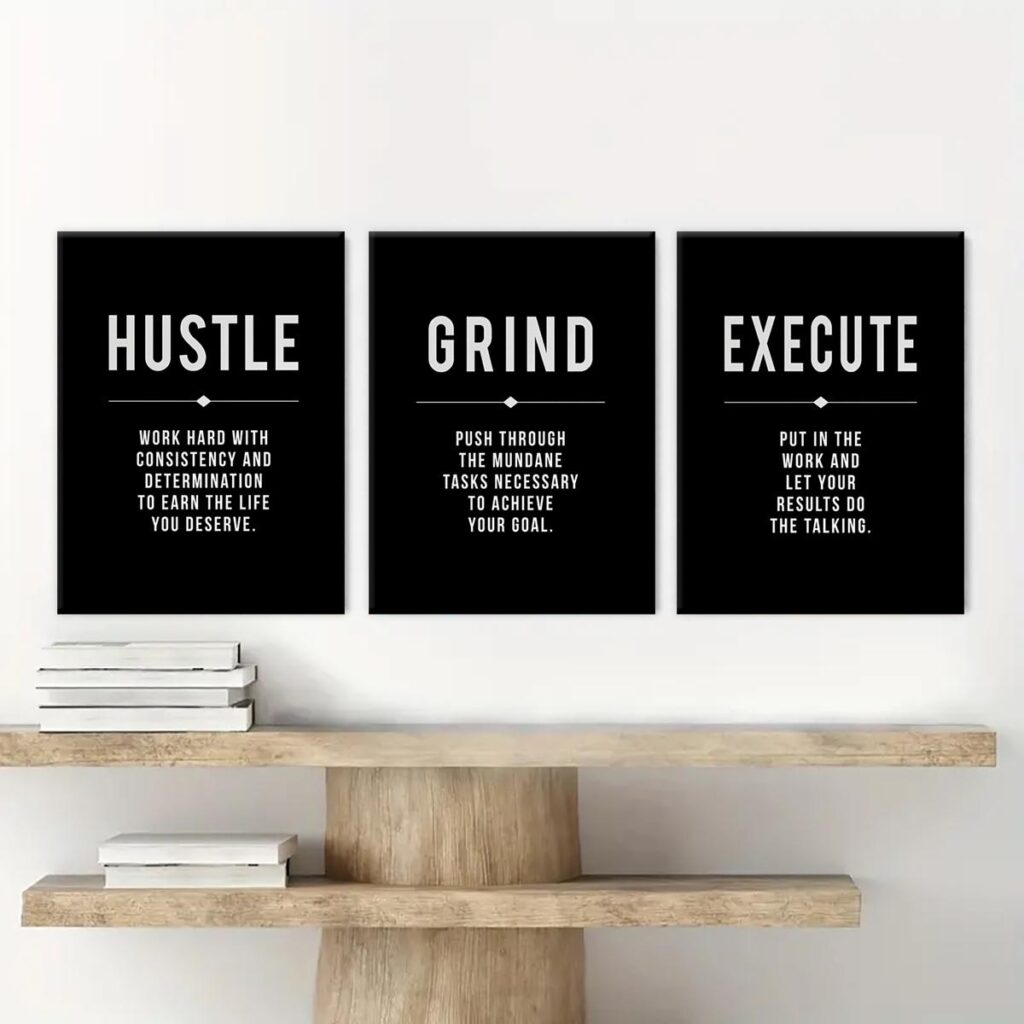 Hustle Grind Execute canvas wall art trio in a modern workspace