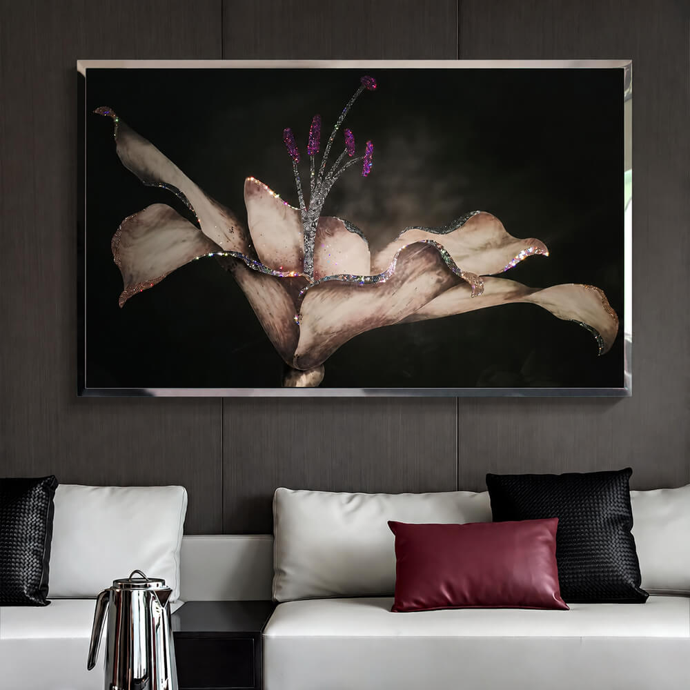 Lily wall art with crystal accents in a metal frame above a sofa