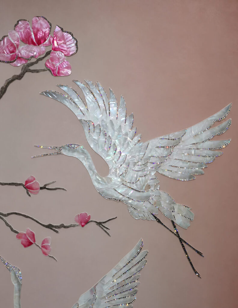 Close up of crystal accents on a mother of pearl crane