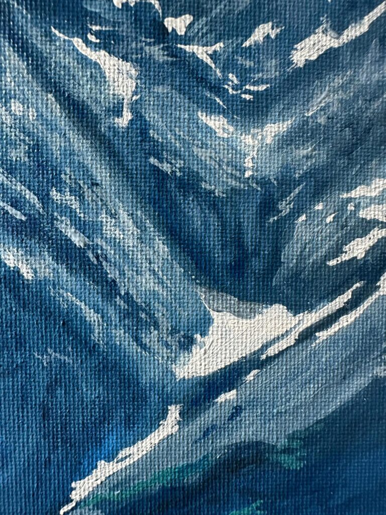 Close up of textured canvas and white mountain brushstrokes