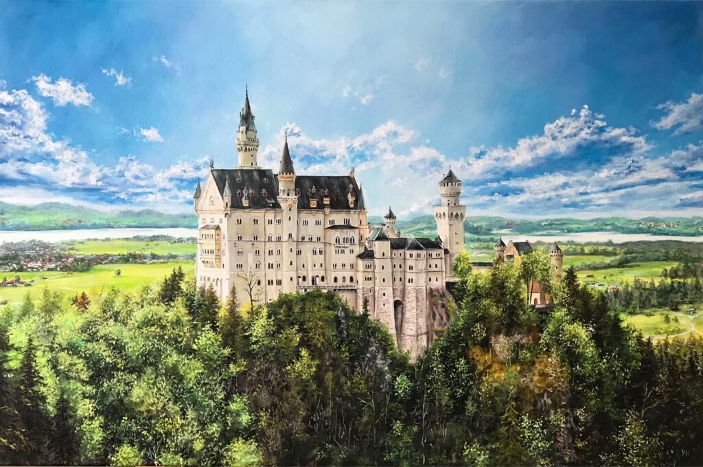Neuschwanstein Castle beneath a blue Bavarian sky and green forest