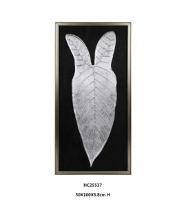 Framed silver metallic leaf wall art on a black background