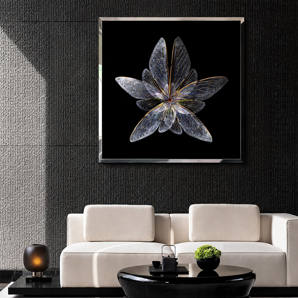 Framed silver wing wall art above a white sofa on a dark wall