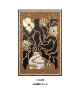 Black and gold floral wall art with a rounded white vase on cork