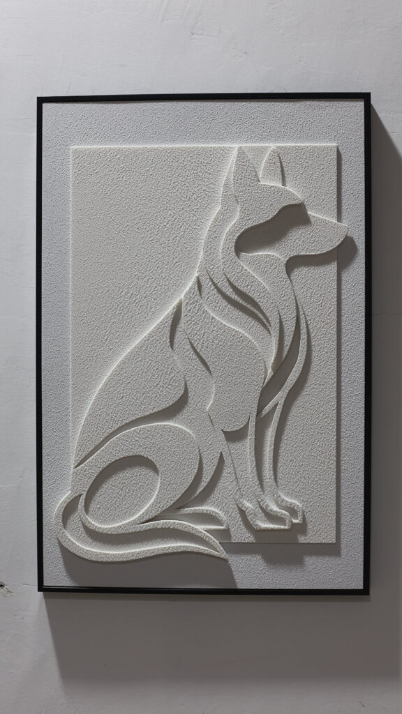 Dog Silhouette Textured Wall Art with ivory relief and a black frame