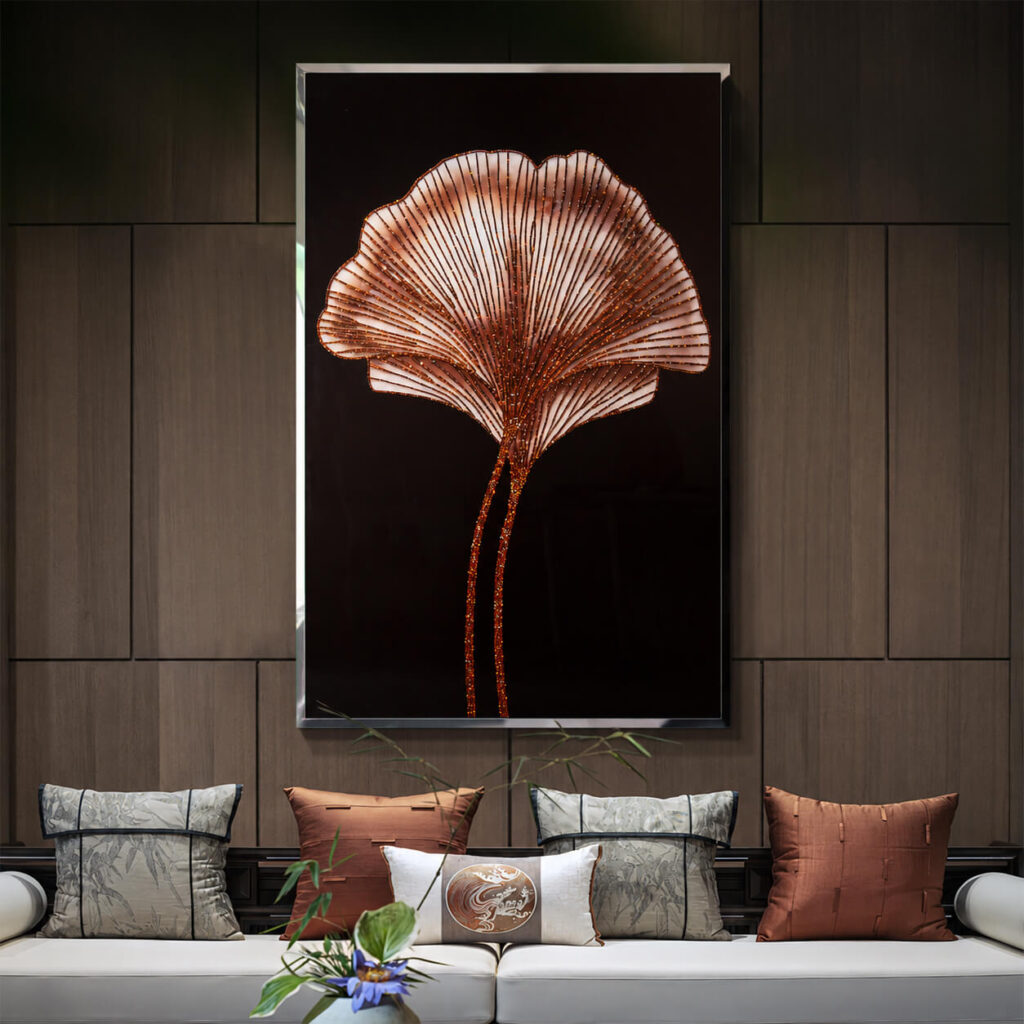 Silver framed ginkgo wall art above a sofa