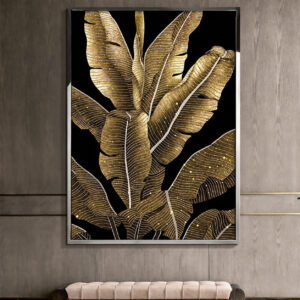 Gold tropical leaf wall art with a silver tone frame