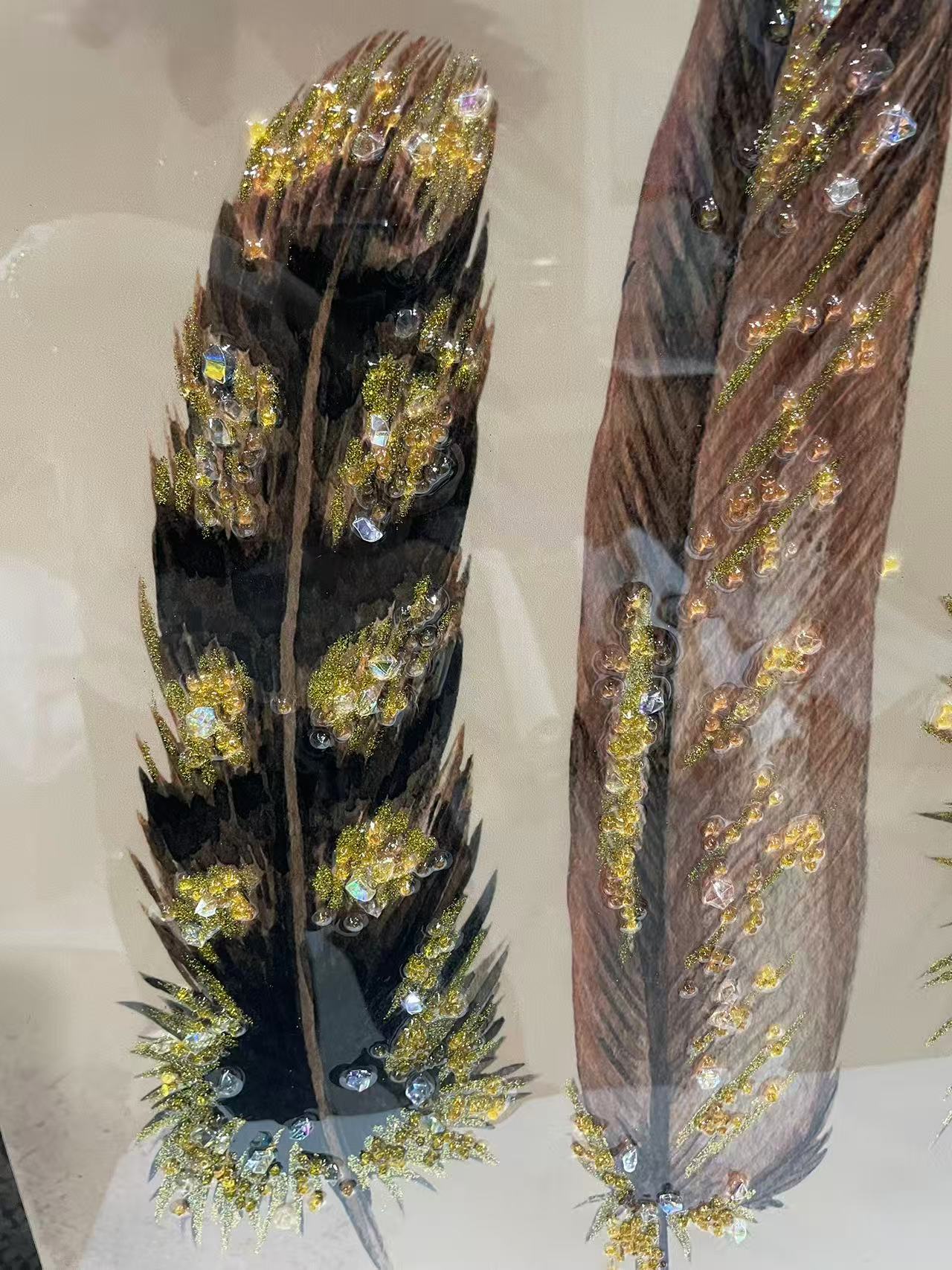 Detailed view of luxury feather wall art with diamond sparkle.