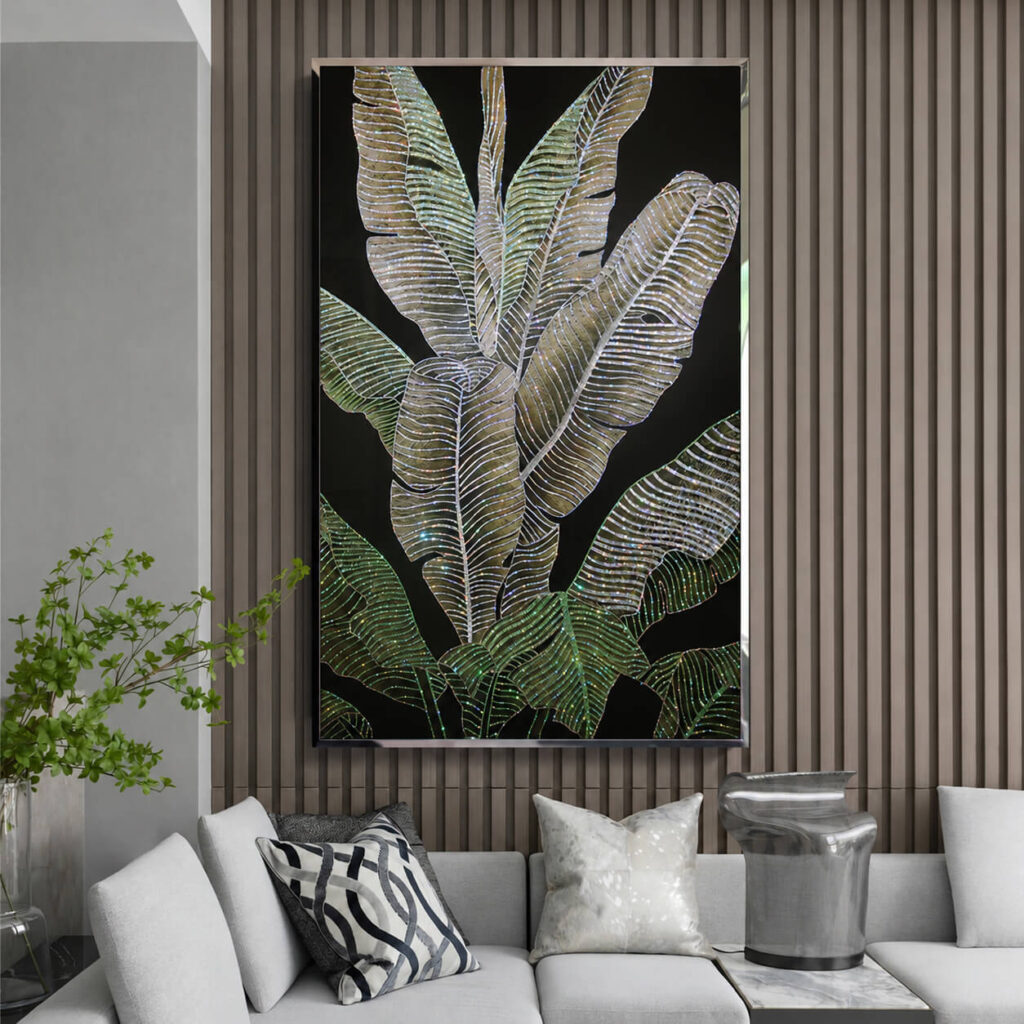 Crystal tropical leaf artwork on a vertical wood slat wall