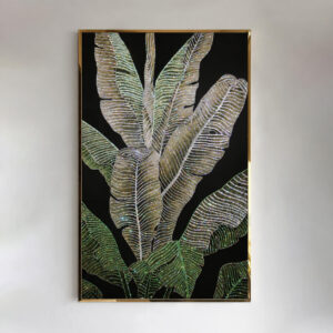 Front view of green and gold tropical leaves with crystal accents and a gold frame
